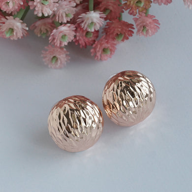 Rose gold textured round earrings