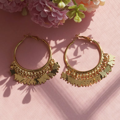 Gold hoop earrings with butterfly charms