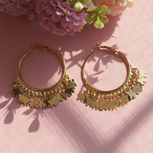 Gold hoop earrings with butterfly charms