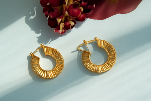 Silver/Gold hoop earrings with a textured design