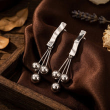 Load image into Gallery viewer, Silver Geometric Ribbon Drop Earrings with Ball Tassels