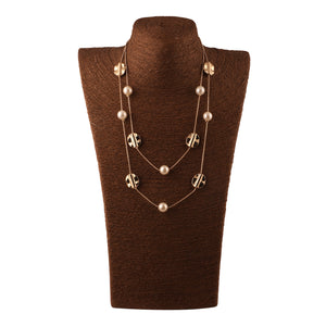 MULTILAYERED NECKLACE WITH METAL BEADS