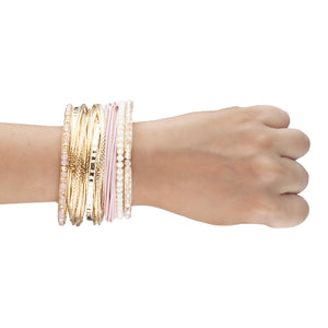 Bunch of exquisite gold and pink bangles with crystal beads