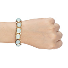 Load image into Gallery viewer, Chunky gold bracelet studded with big blue stones