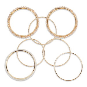 Bunch of pretty white and gold bangles with crystal beads