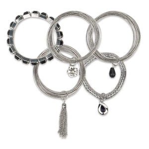 Bunch of chunky silver bangles with dangling crystals and chains